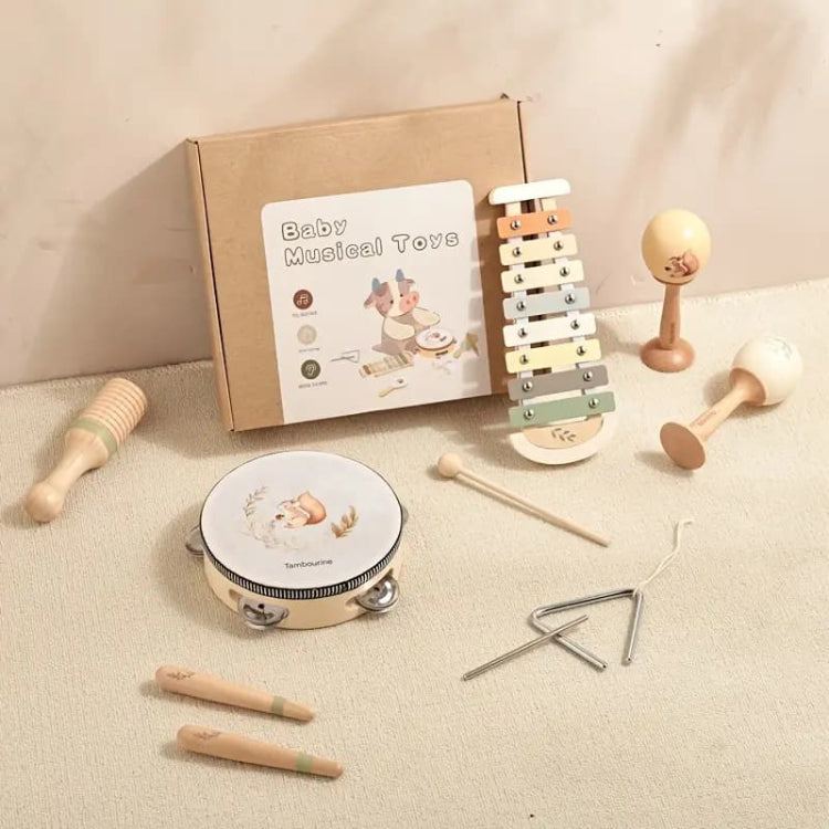 Collection of baby musical toys with a 'Baby Musical Toys' box on a beige surface.