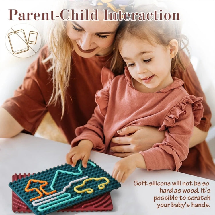 Woman and child interacting with a soft silicone toy