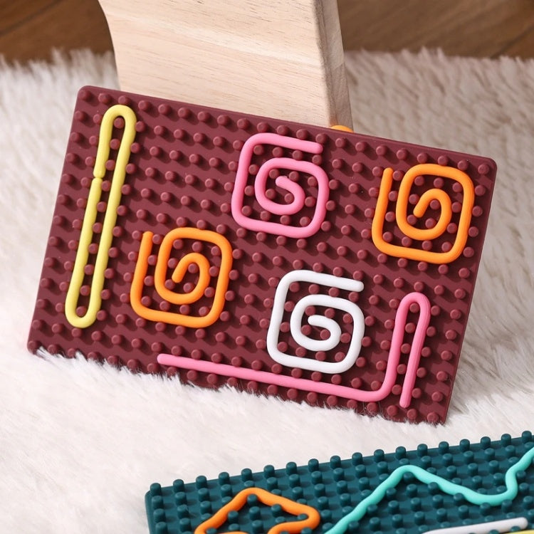 Colorful interlocking foam puzzle on a textured surface