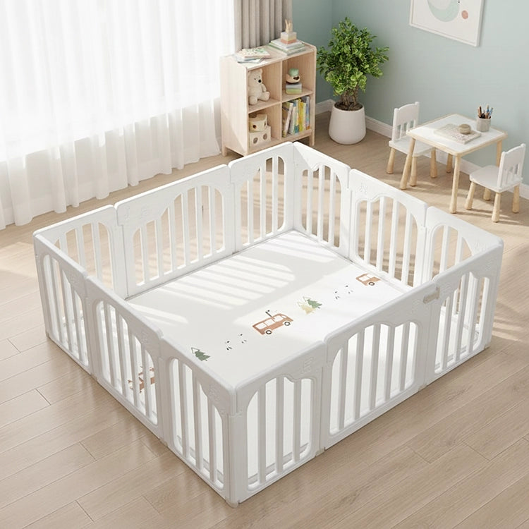 White playpen in a room with a table and chairs