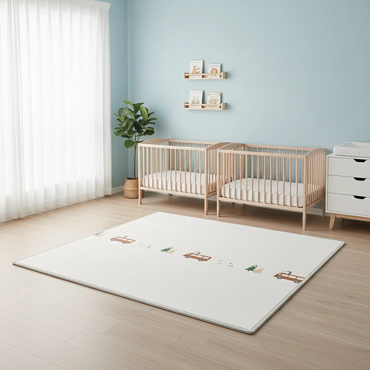 Children's room with wooden crib, changing table, and rug with car designs.