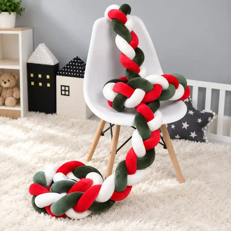 Red green and white Christmas braided knot decorative cushion from iKids.co.za