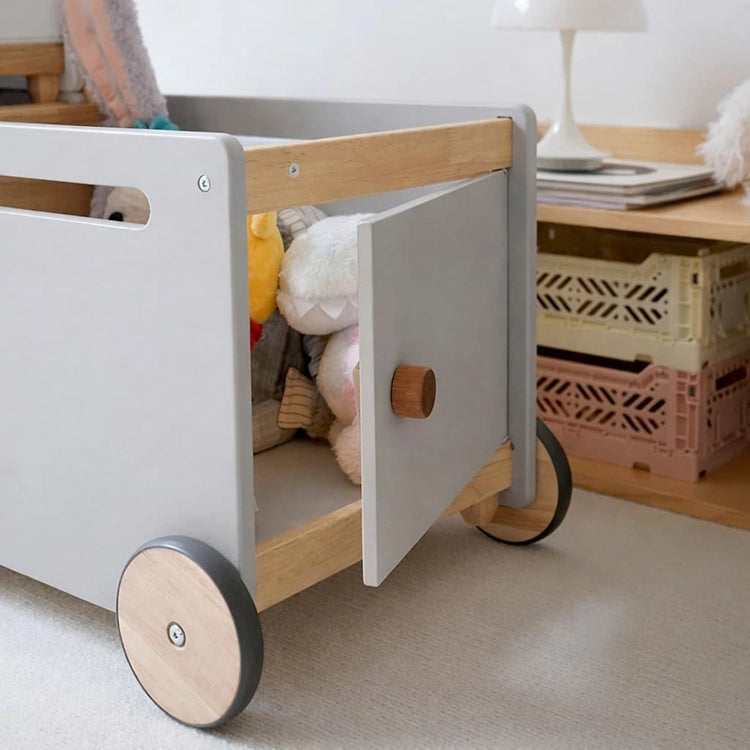 Children's toy cart with wooden wheels and a white door in a room setting. Nordic Grey Multi-Function Wooden Storage Trolley & Walker