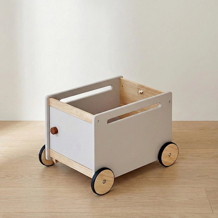 Wooden toy cart with wheels on a wooden floor. Nordic Grey Multi-Function Wooden Storage Trolley & Walker