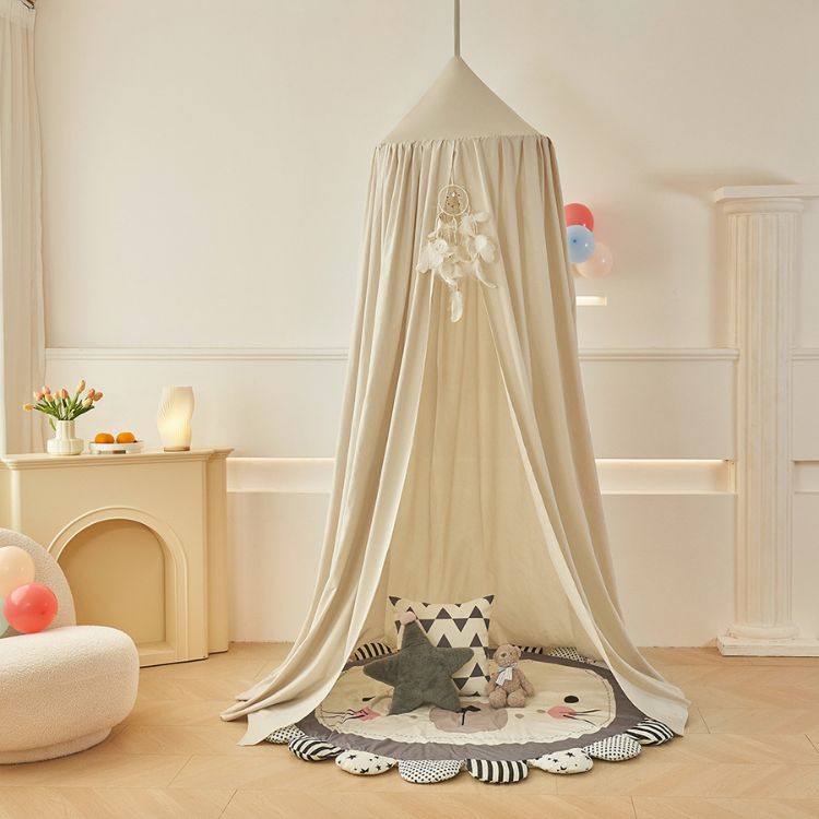 Children's room with a canopy, toys, and decorative elements.