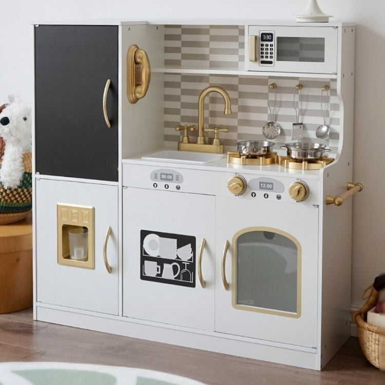 Children's play kitchen set with toy appliances and utensils on a wooden floor.