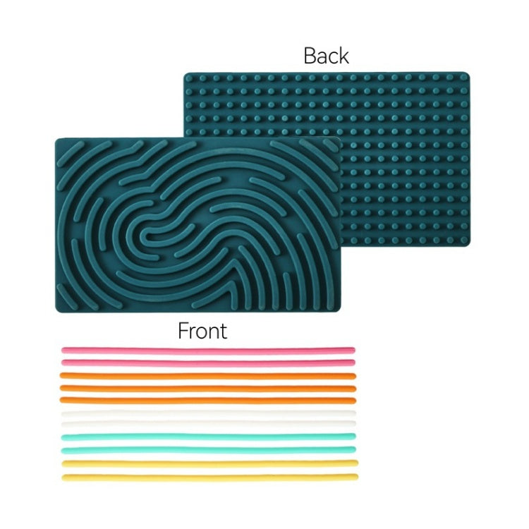 Teal silicone mat with textured back and colorful straws on a white background