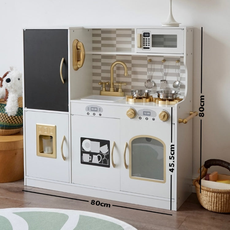 Children's play kitchen set with realistic appliances on a wooden floor.