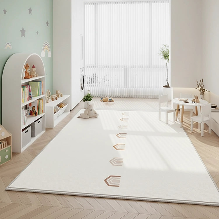 Modern children's room with a white rug, bookshelf, and toys.