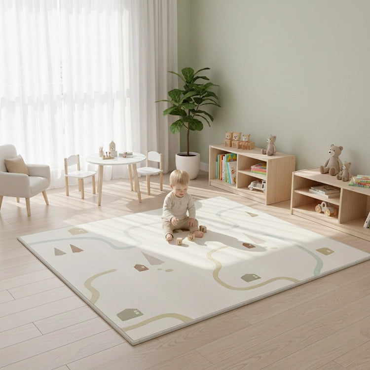 Child playing on a rug in a modern living room with furniture and decor.
