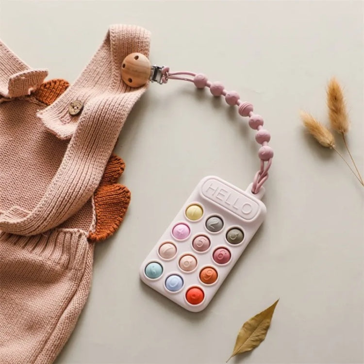 Colorful baby teething toy with 'HELLO' on a light background