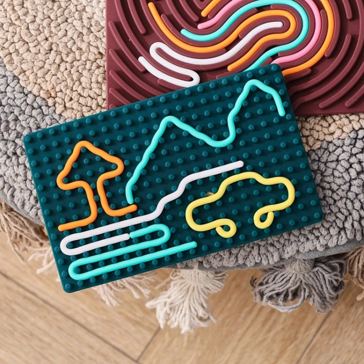 Colorful interlocking brick set on a textured surface